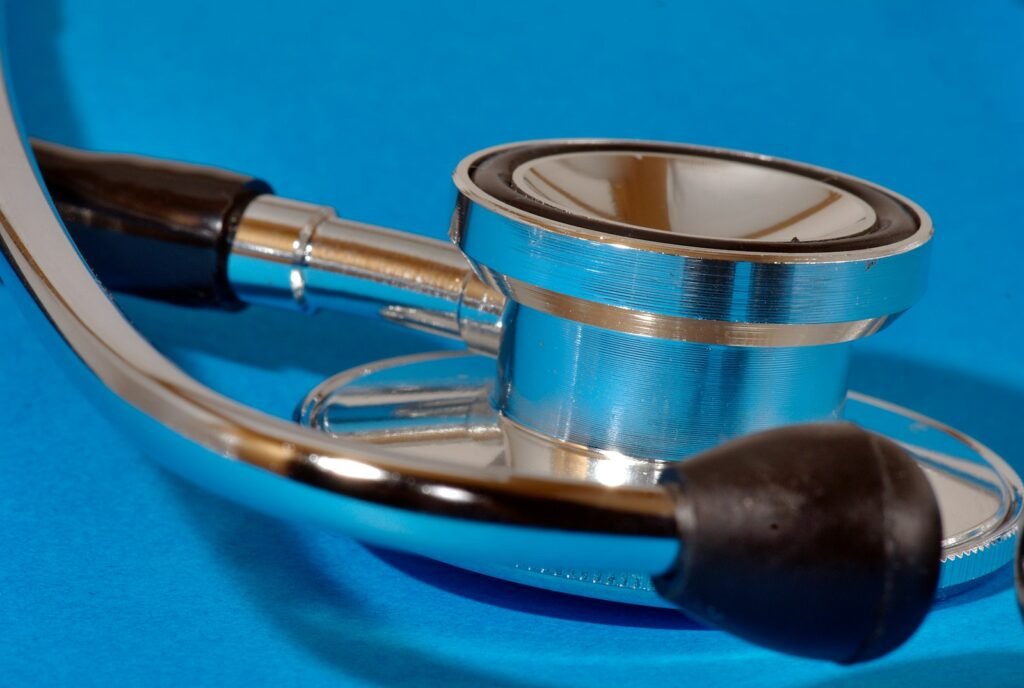 a medical stethoscope laying on a blue surface; 2027 ACA open enrollment